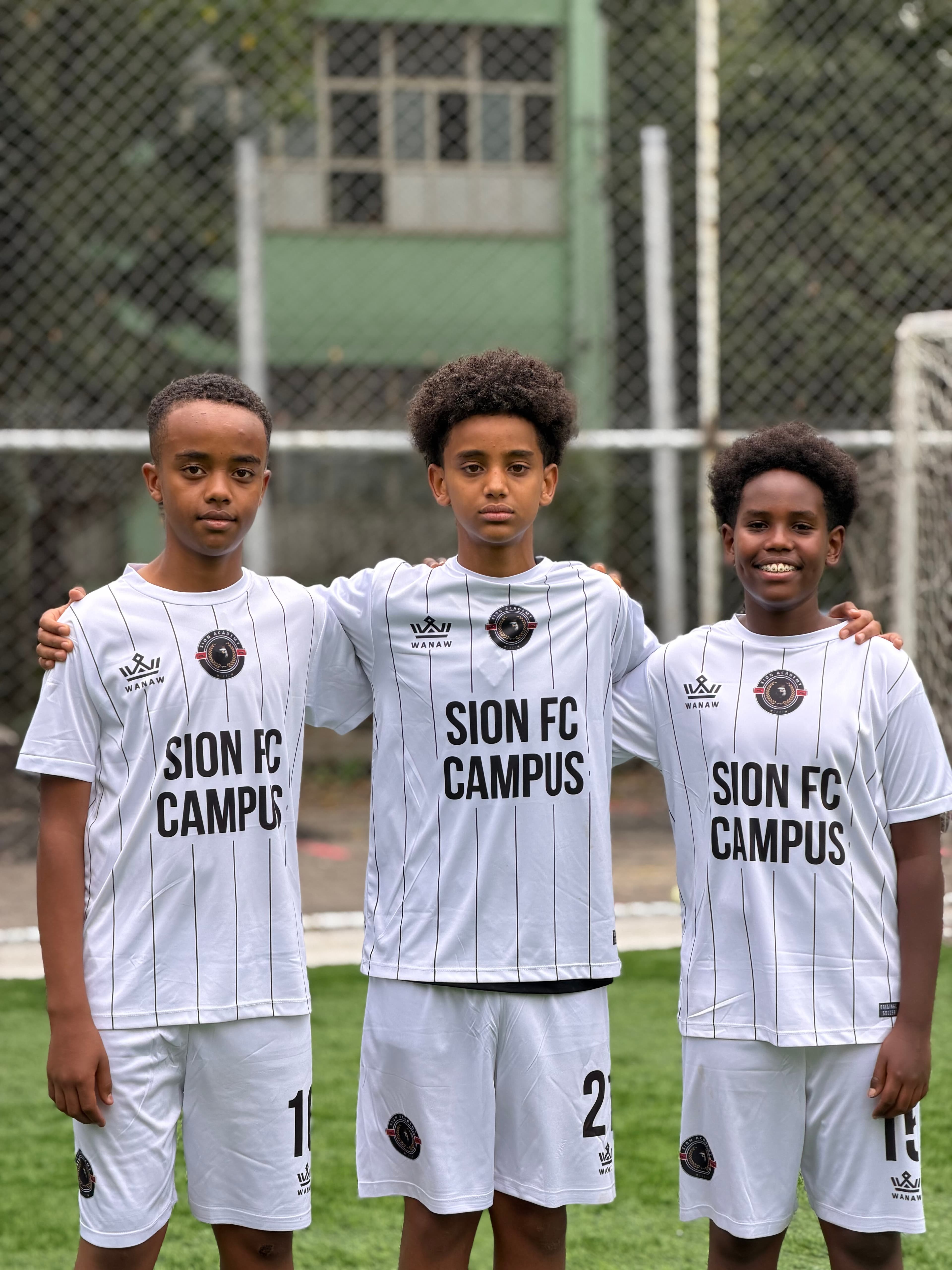 Sion Academy summer camp players wearing the academy kit